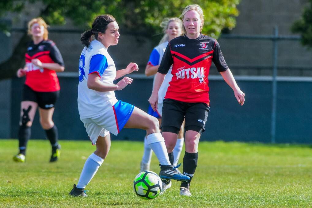 CALM: Georgia Barr holds possession on Saturday in the title-sealing clash with Ulverstone. Pictures: Neil Richardson