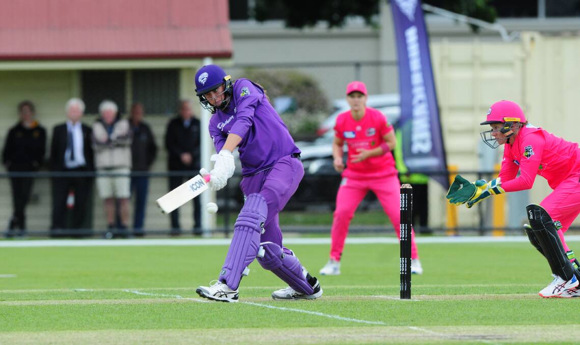 MISSED: Hurricanes opener Erin Fazackerley swings hard with no luck against the Sixers attack.