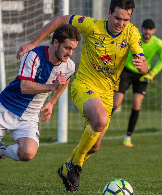 PURSUIT: Ranger Pat Lanau-Atkinson leads the chase for possession against the Strikers. Picture: Phillip Biggs