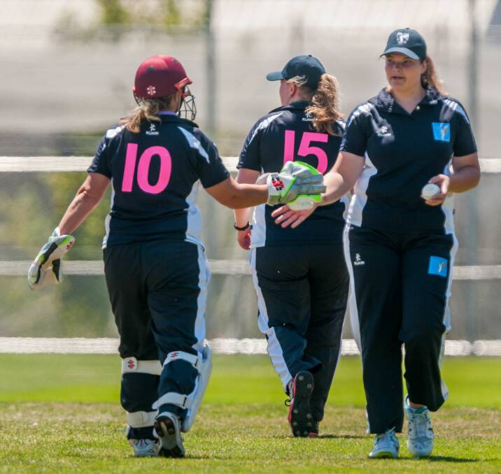 LET'S DO THIS: Cricket North wicketkeeper Lynn Hendley passes on her best to teammate Nicola Dusatoy against North-West. Picture: Phillip Biggs