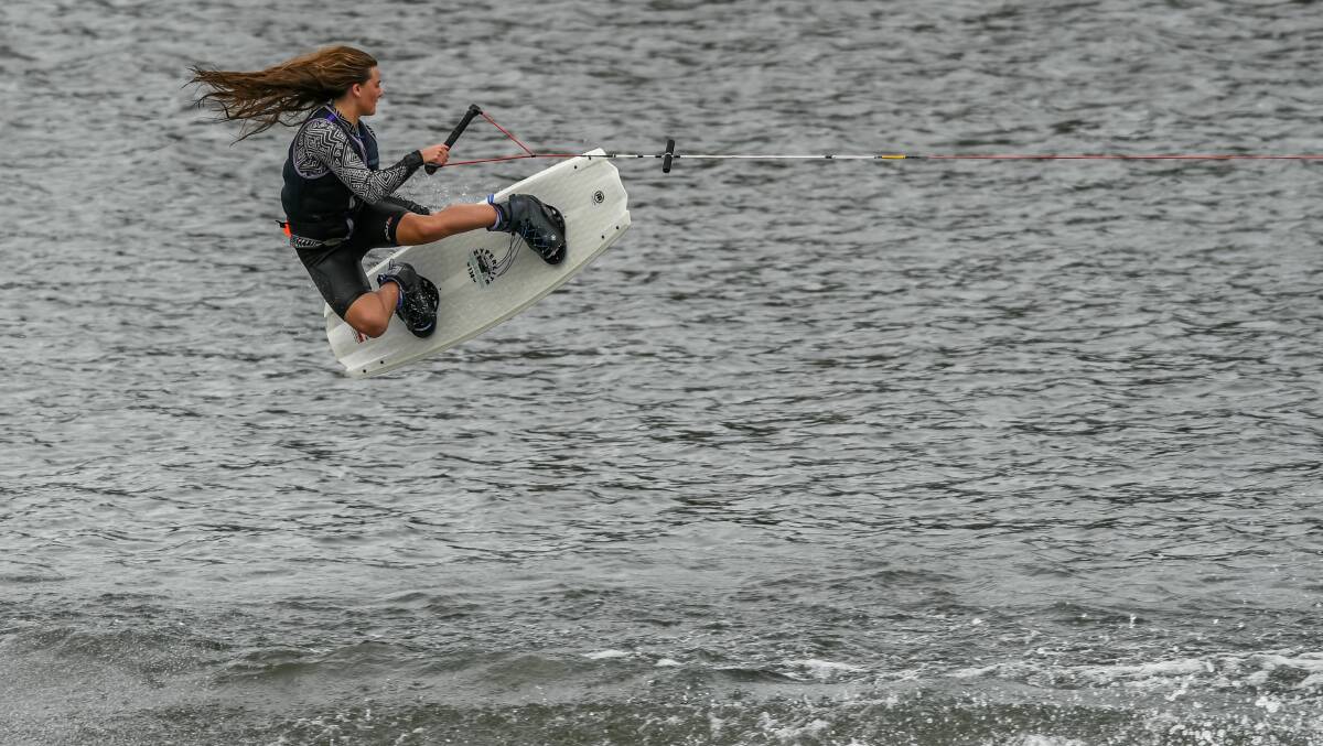 AIRBORNE: Brieanna Hill flies high above the water and returns to win the women's division. 