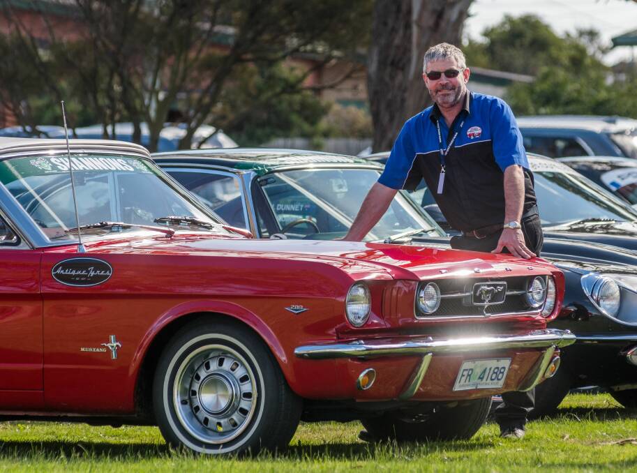 COOL RIDE: National Automobile Museum of Tasmania manager Phil Costello shows off the 1964 Mustang back in George Town. Picture: Phillip Biggs