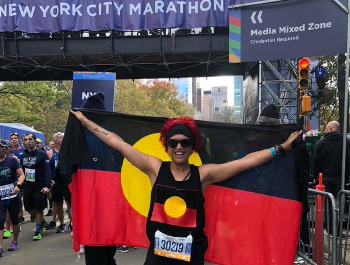 I DID IT: Launceston's Lutana Spotswood poses with the obligatory flag at the New York Marathon. Picture: Supplied