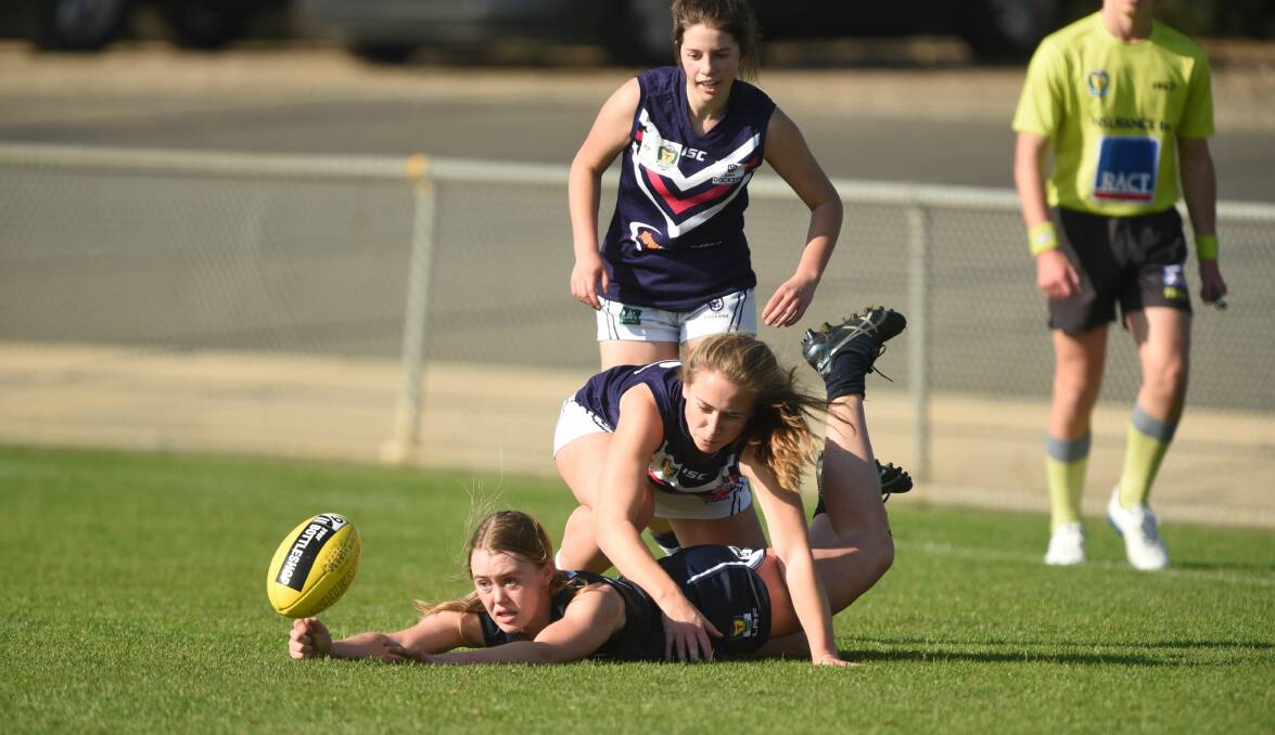 WOMAN DOWN: Launceston talent Camilla Taylor hits the ground amid physical Burnie pressure during Sunday's TSLW encounter at Windsor Park. Picture: Paul Scambler