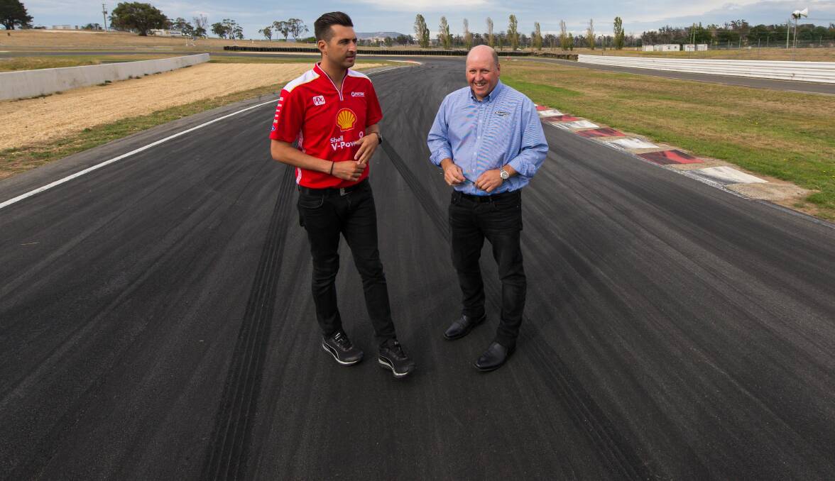 ROADWORTHY: Motorsport Tasmania boss Donald Potter with driver Fabian Coulthard on the Symmons Plains track during happier times. Picture: Phillip Biggs