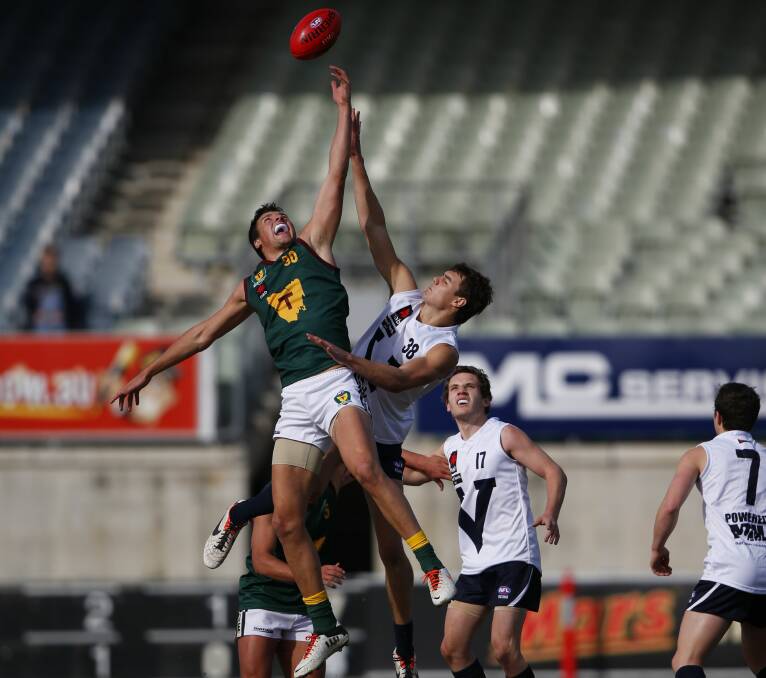 TAP: Toby Nankervis leaps against Victoria Metro at the under-18s nationals.