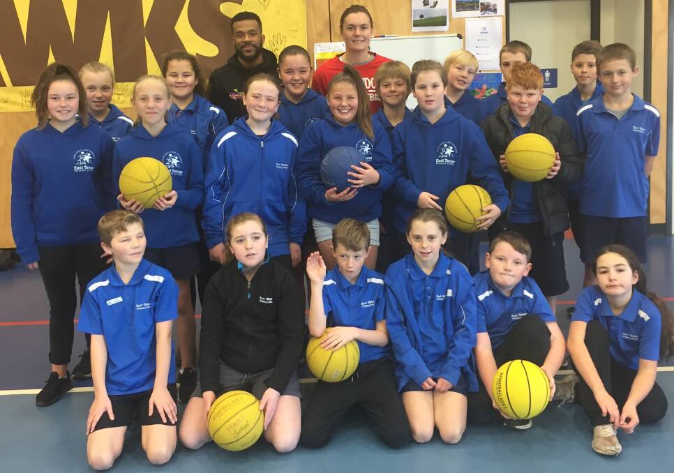 BACK TO CLASS: Launceston Tornadoes coach Derrick Washington and import Stella Beck take a break from their clinic at East Tamar Primary School. Picture: Andrew Mathieson