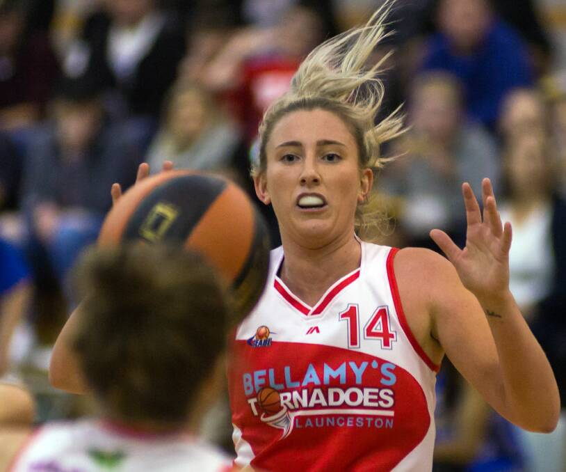 HANDS UP: Tornadoes star Lauren Nicholson led the way for her side in the one-point loss to the Canberra Capitals.
