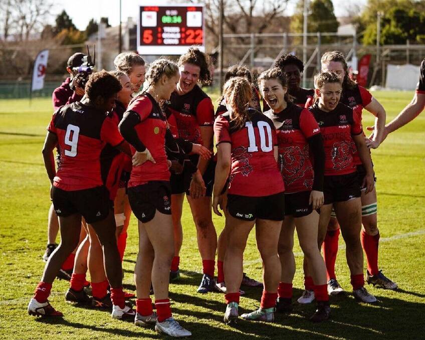 GOOD TIME: UTAS Lions celebrate an improved campaign in Hobart at the National University Sevens Series. Picture: Supplied