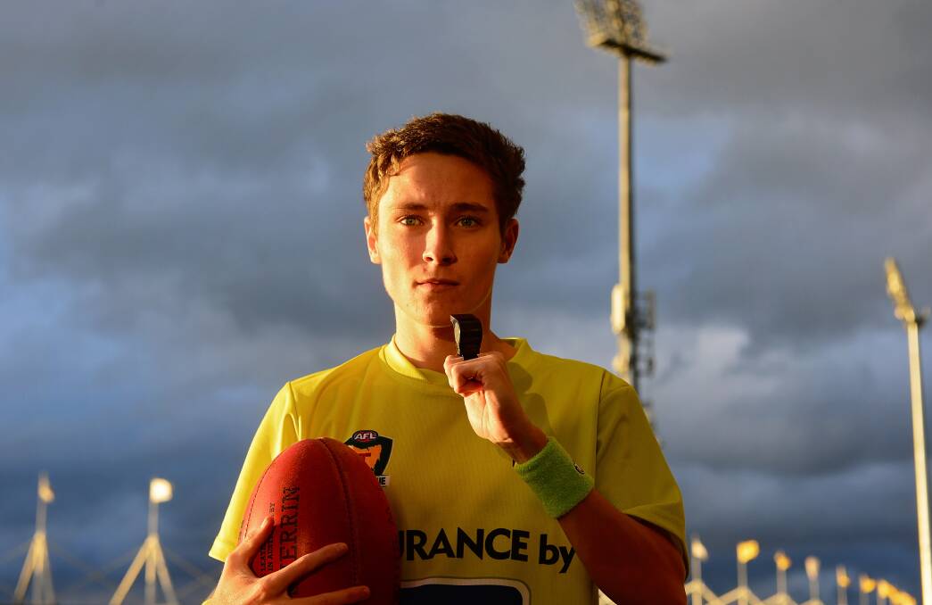 BIG TIME: Rising umpire Tomas McIntee, 18, prepares to practice his whistle blowing for his TSL senior debut at the weekend. Picture: Phillip Biggs