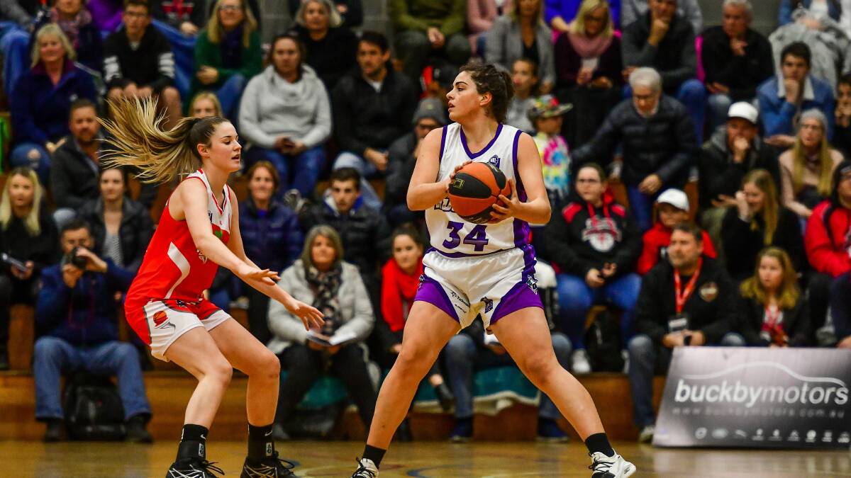STAND-OFF: Huskies recruit Ellie Collins looks to figure out a way around Tornado Sarah O'Neill. 