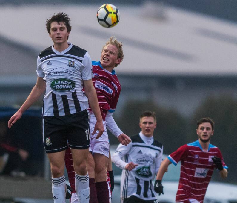 LEAP OF FAITH: Launceston City's Noah Mies and Northern Ranger Harry Thannhauser contest a high ball during last Saturday's NPL Tasmania derby game. Picture: Phillip Biggs