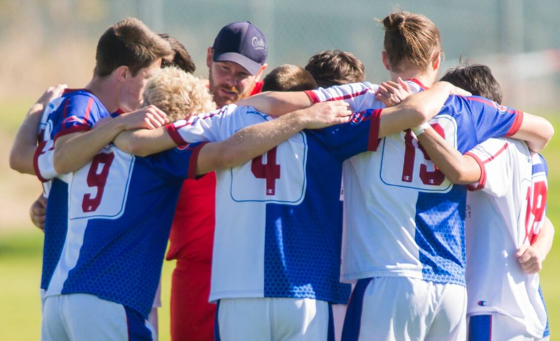 SOUND ADVICE: Veteran Marshall Pooley has a word to the young Rangers playing group last week before returning in goal for the club's NPL side at the NTCA No.2 ground. Picture: Phillip Biggs. 