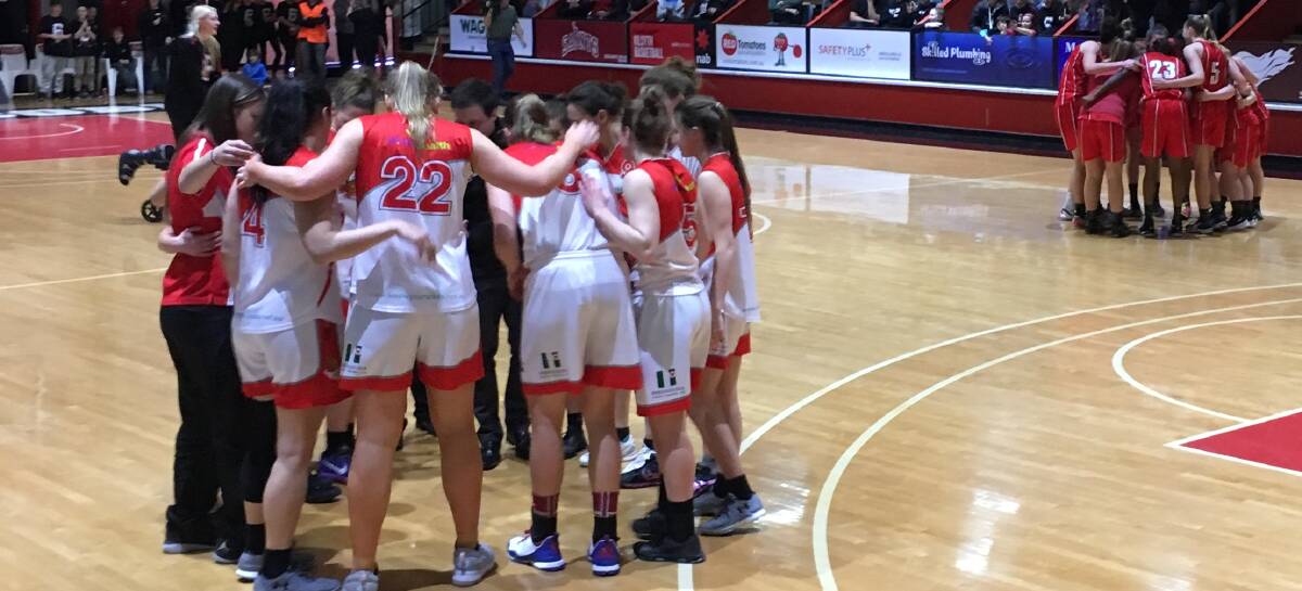 UNITED WE STAND: Launceston Tornadoes gather in the pre-game huddle before their south conference final against Kilsyth on Saturday night in Melbourne. Picture: Jordie Gray