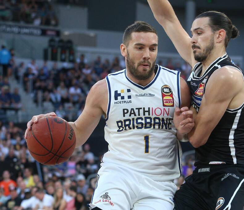 CALL HOME: NBL veteran Adam Gibson contests against respective Tasmanian Chris Goulding after his rival days ago quashed any thought of returning to his home state while Gibson is open to the idea of joining a new side. Picture: NBL