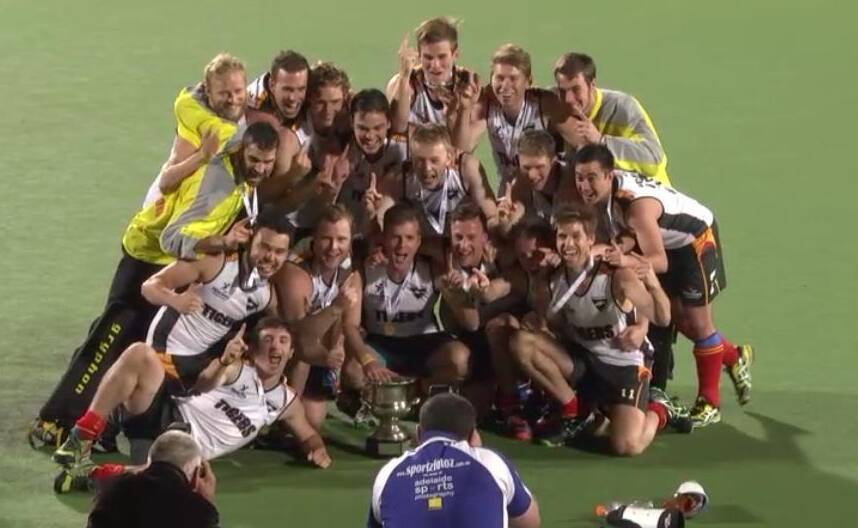 BACK WHEN: Tassie Tigers celebrating their inaugural 2014 AHL title win. Arthur is located at the back, second from far right. Picture: ClickInFocus