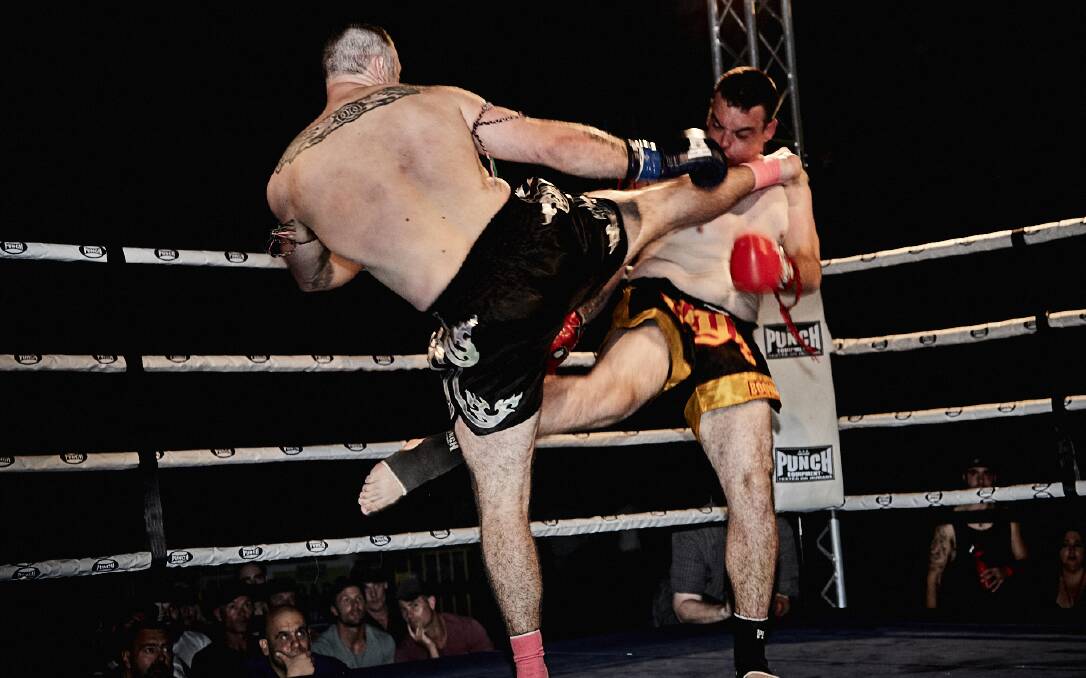 OUCH: Kainen Walsh takes the full force from Brett Haley in their encounter at the Muay Thai fight night on Saturday in Launceston. Picture: Dave Groves