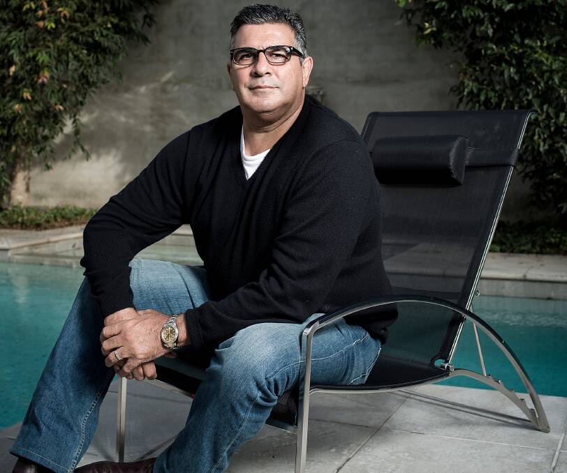 CONVINCED: A relaxed Andrew Demetriou relaxed in his Melbourne home free of the hustle of his former AFL role in favour of advising the NBL on its future direction that includes a certain Tasmanian team. Picture: AAP