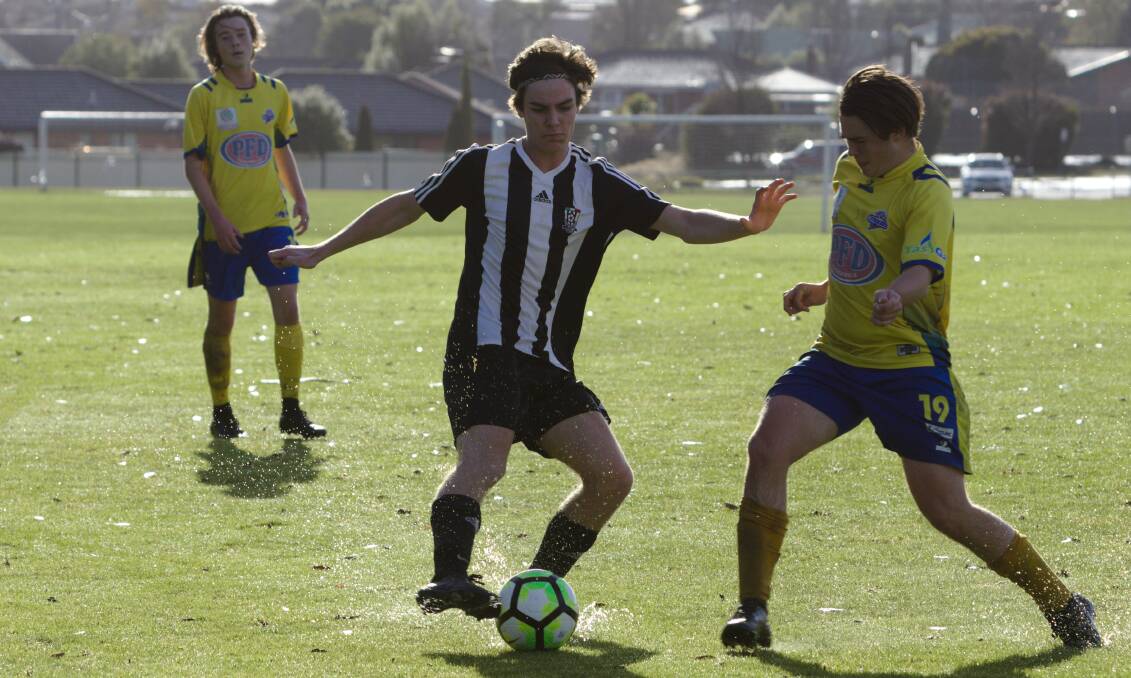 SPLASH: Launceston City talent Will Compagne shows a clean set of heels in the crucial game against Devonport City. Pictures: Jamie Richardson