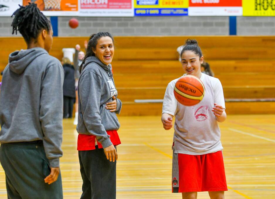Ally Wilson shares a laugh with Courtney Williams and Aishah Anis