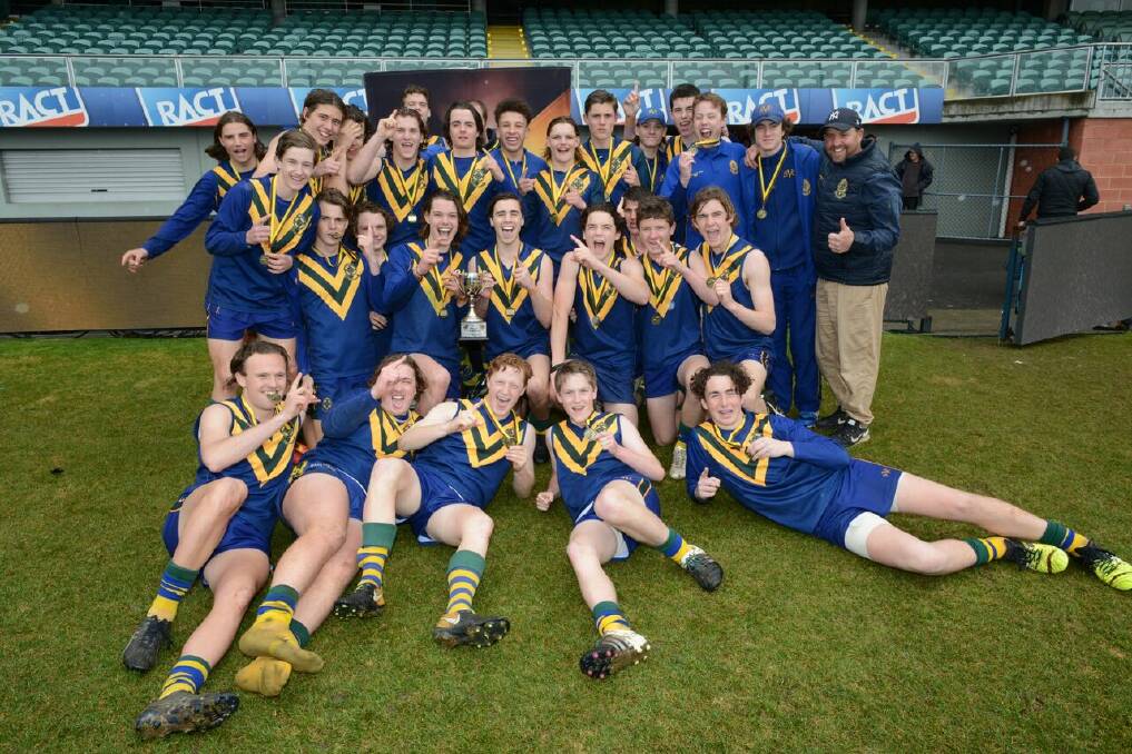 WINNERS: St Virgil's College, of Hobart, celebrate the spoils of a Tassie Hawks Cup win. Picture: Supplied