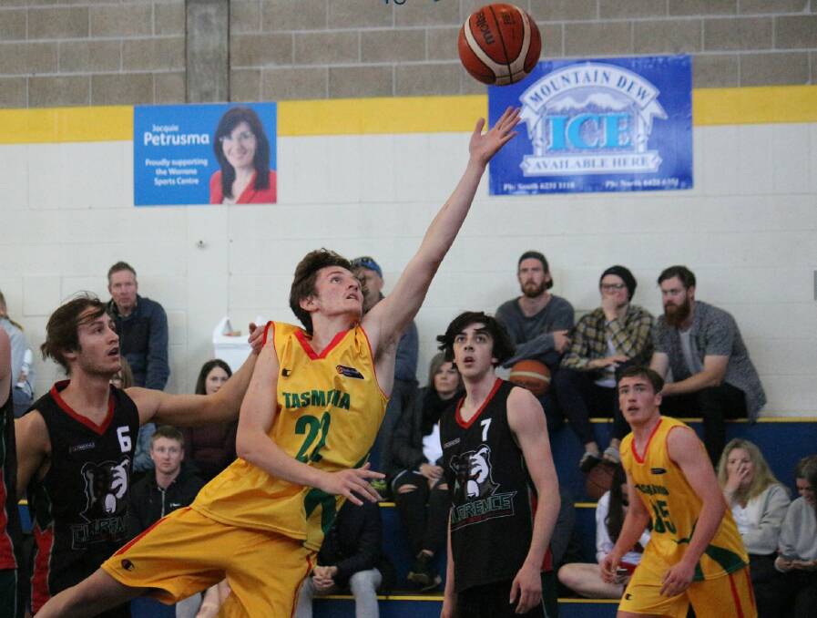 INITIATIVE: Basketball Tasmania High Peformance's Jackson Lowe drives to the basket. Pictures: Basketball Tasmania