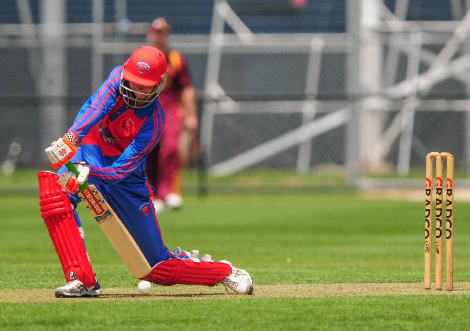 HEAD DOWN: Latrobe batsman Blake Weeks attempts to dig the ball out of the wicket.