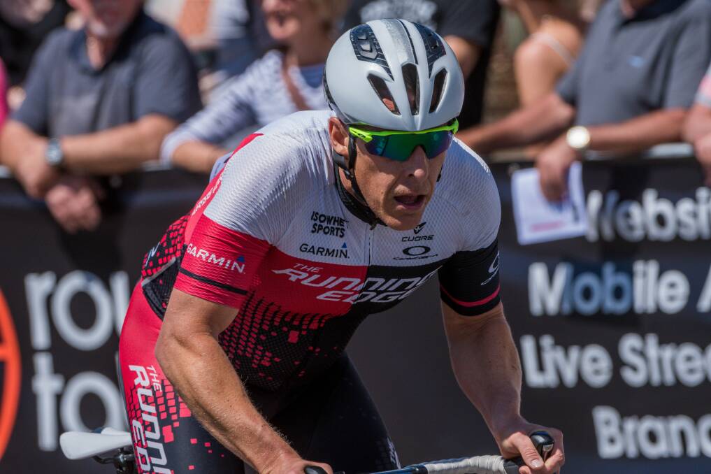 FRONTRUNNER: Hobart triathlete Hayden Armstrong on the bike this summer. 