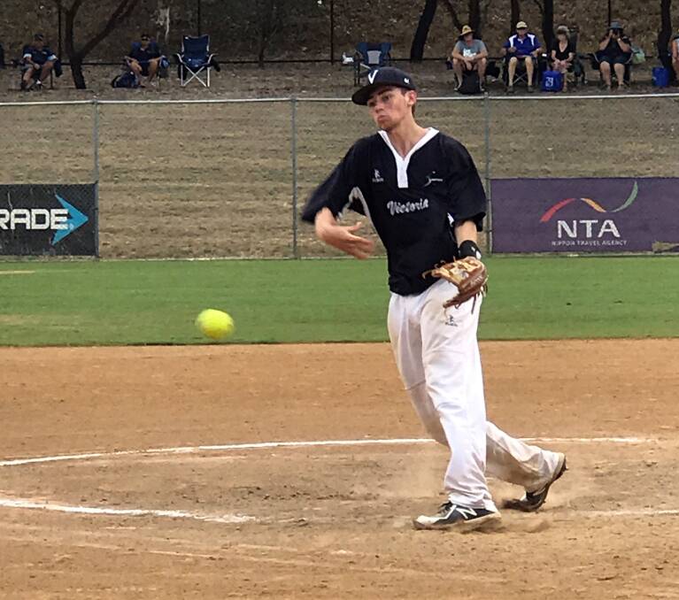 TAKE THAT: Launceston teenager Connor Watke sends down a fastball with heat while playing for his adopted Victoria during the recent under-19 softball nationals. Picture: Supplied.