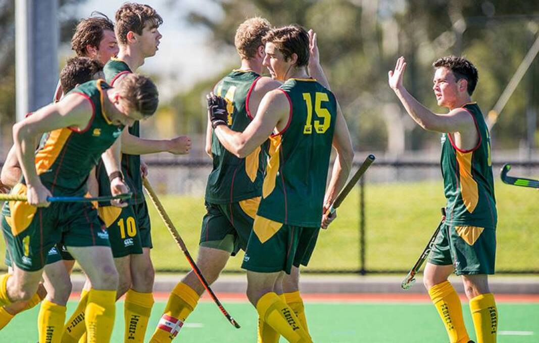 HIGH FIVE, GUYS: Tasmanian players gather to celebrate a goal together in Friday's classification game against the ACT in Wollongong. Picture: Click In Focus