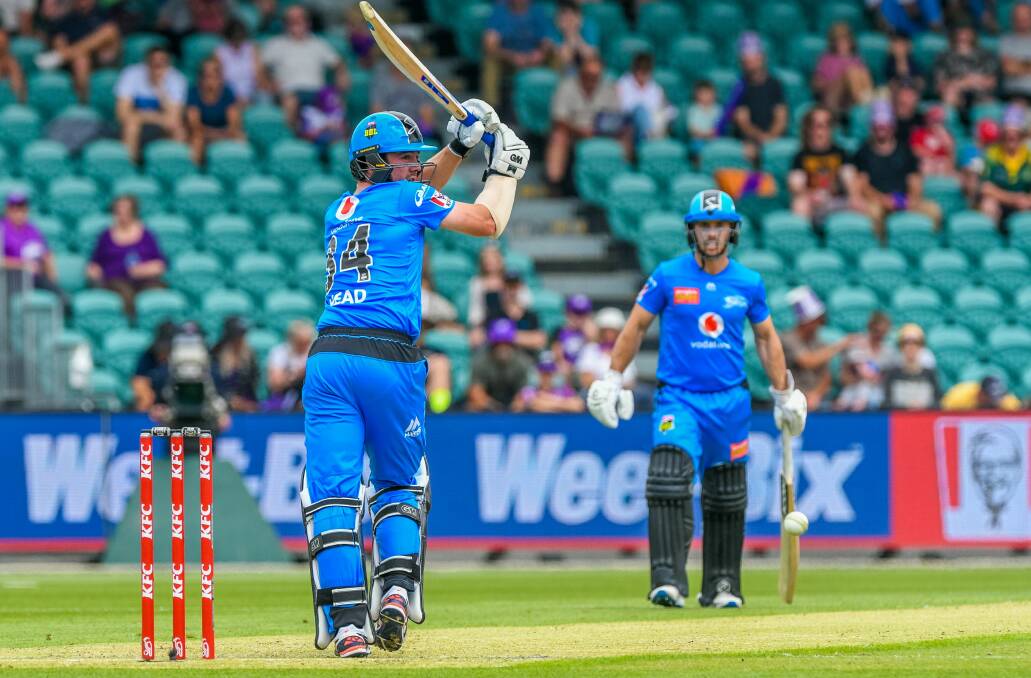 ALL CLASS: Adelaide Strikers talisman Travis Head clips one of the finer shots of the day off his pads for six.