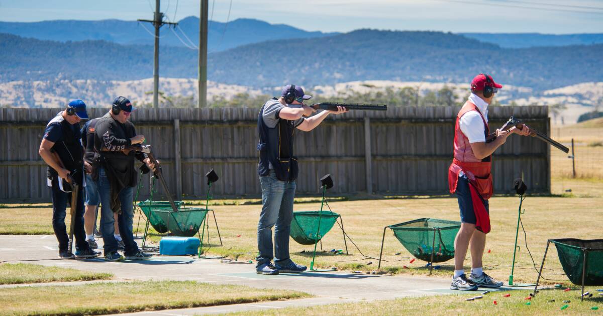 STRAIGHT SHOOTERS: Clay target marksman survey the scene during last year's state single barrel championship at the Tasmanian Gun Club in Evandale. Picture: Paul Scambler
