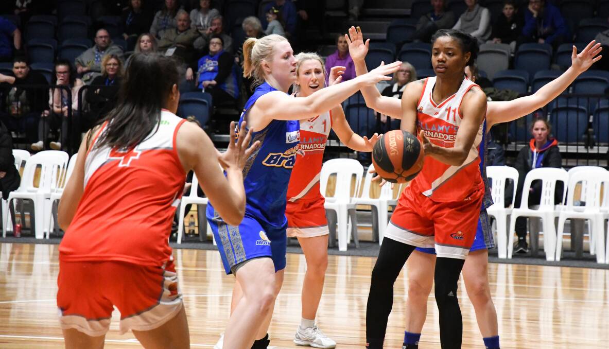 GIVE IT TO ME: Tornadoes star Ally Wilson calls Courtney Williams for the ball in the final's clash with Bendigo. 