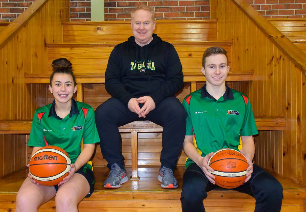 OFF TO CANBERRA: Australian under-17 boys coach Mark Radford with national squad members Sharn Hayward and Reyne Smith. Picture: Brad Cole.