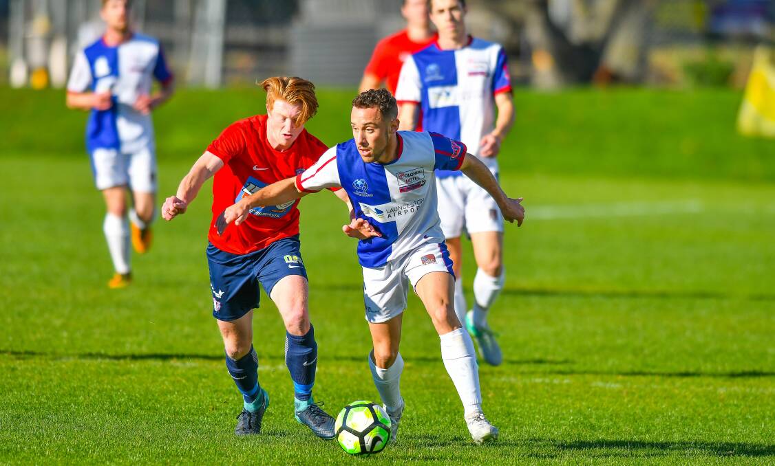 PRESSURE: Argentinean Federico Cano Colaianni looks gather possession for Rangers against South Hobart.
