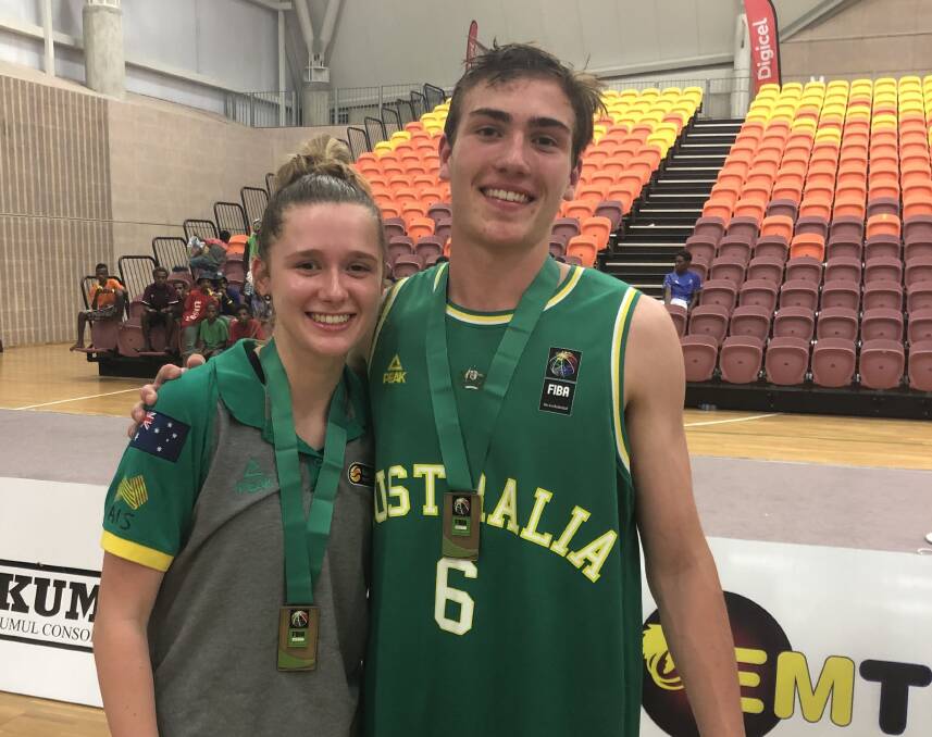 WINNERS: Ulverstone gold medallist Zoe Crawford congratulates Riverside talent Sejr Deans moments after Australia completed wins in both the boys and girls Oceania Cup under-15 finals in Papua New Guinea. Picture: Supplied