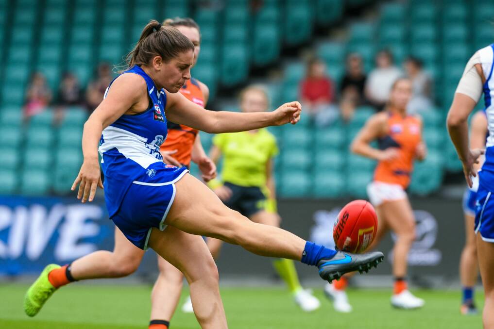 HERE IT COMES: Ashleigh Riddell gets onto her right foot with a centering kick towards the Roos' goal mouth.
