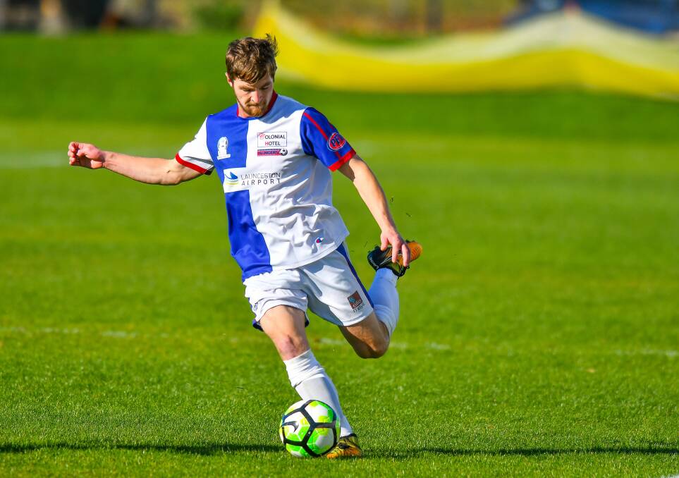 MEASURED: Simon Lucas looks to deliver a long ball for Northern Rangers. Picture: Scott Gelston