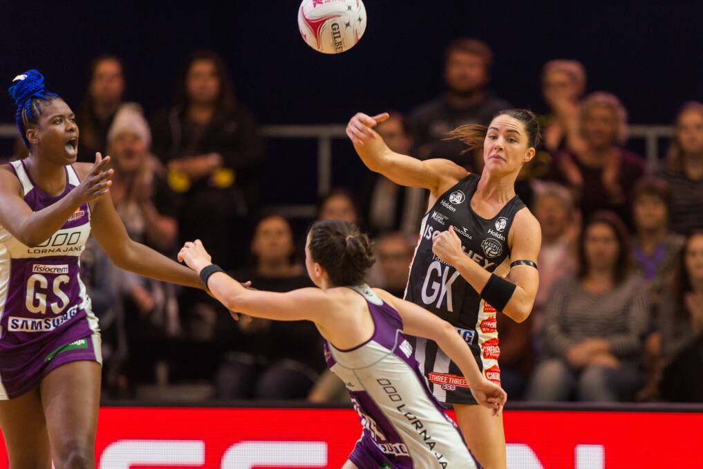 BOMBS AWAY: Crowd favourite Sharni Layton attempts to pass over the top of the Firebirds defence during the antipcated Super Netball game.
