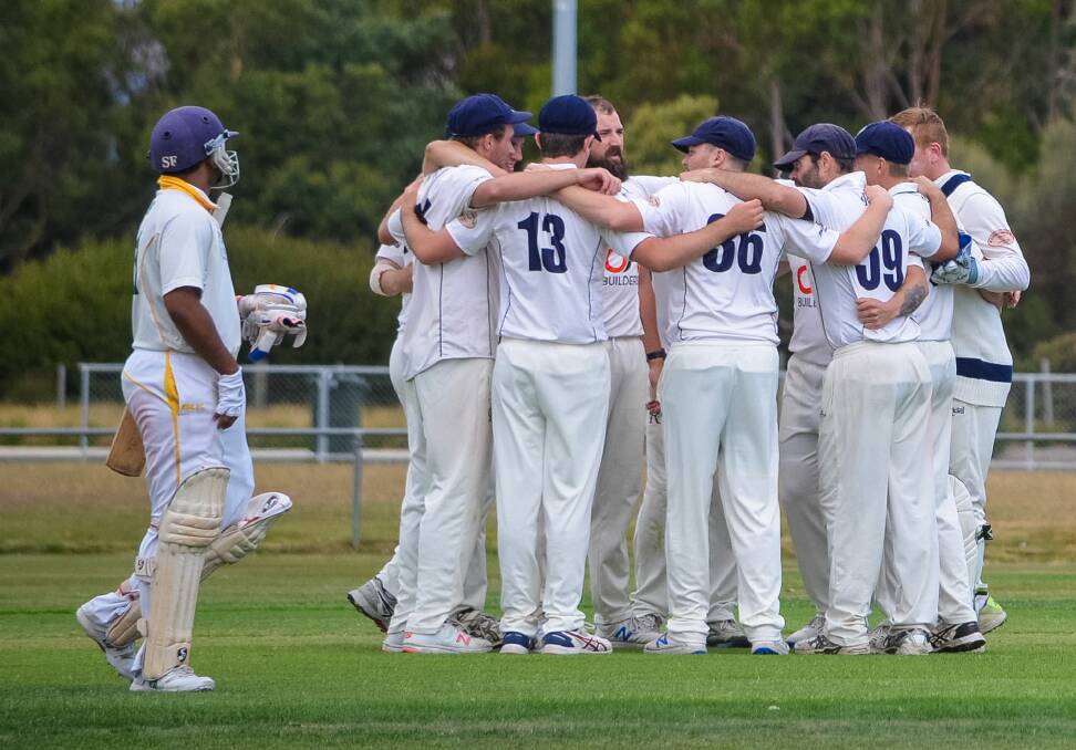 GET AROUND US: Riverside show a united front in a tense two-run win over South Launceston on Sunday at Windsor Park. Picture: Andrew Mathieson