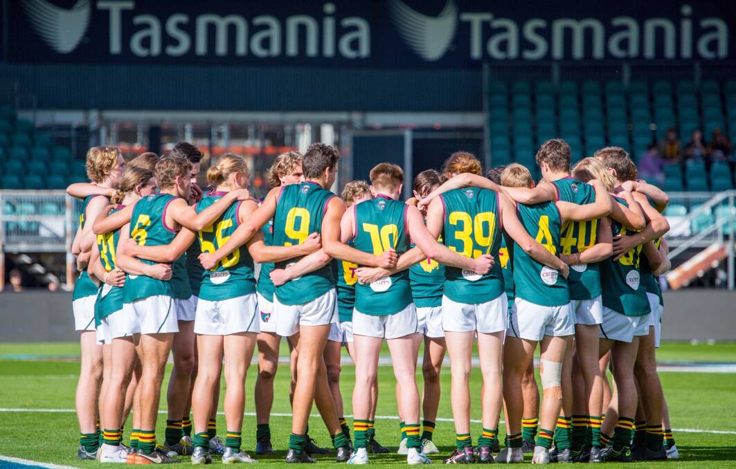 STANDING AS ONE: Tasmania Devils all huddle together moments prior to the start of Sunday's under-18s encounter against Western Jets at UTAS Stadium. Picture: Solstice Digital