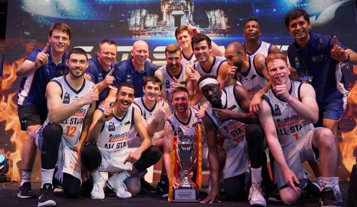 TOP OF THE WORLD: NBL1 All-Stars celebrate its world invitational tournament win Wednesday night in Thailand.