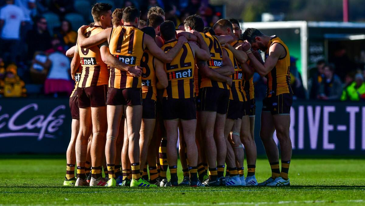 TIGHT: Hawthorn last season huddles together at UTAS Stadium while they could. Picture: Scott Gelston
