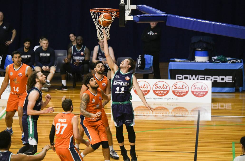 SO CLOSE: Lochlan Cummings attempts to tap in the offensive rebound for Southern Huskies in the New Zealand NBL game at the Silverdome. Pictures: Paul Scambler