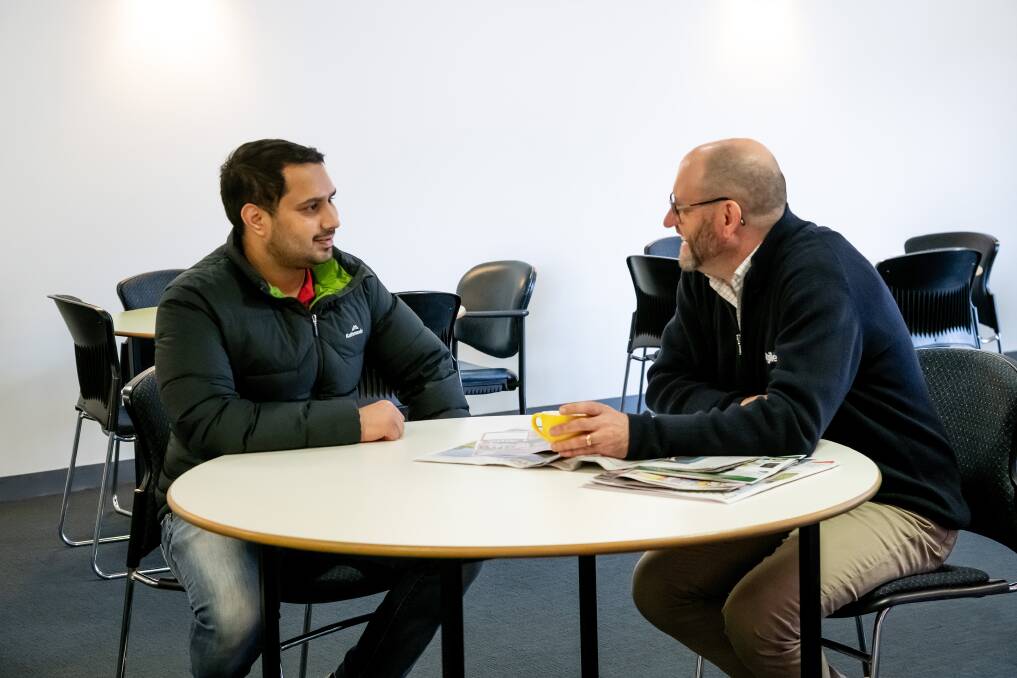 SECURE WORK: StGiles disability support worker Khushwant Singh and Chief Executive Andrew Billing talk over a cup of coffee in the Amy Road centre. Picture: Scott Gelston