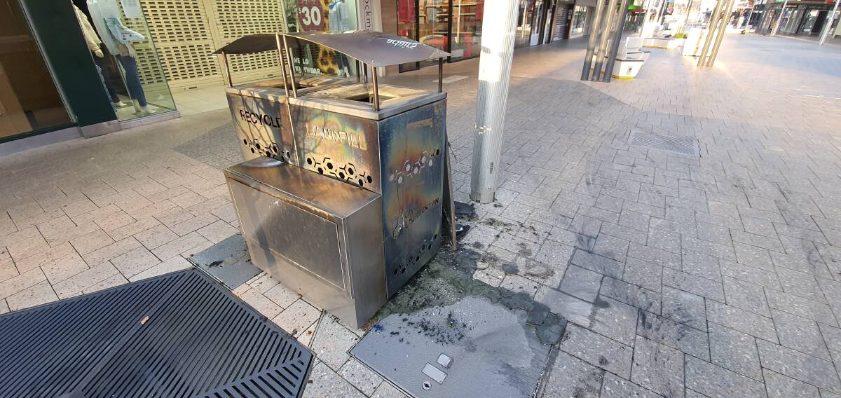 MORE DESTRUCTION: Bins near The Body Shop were also set on fire. Picture: Robin Smith