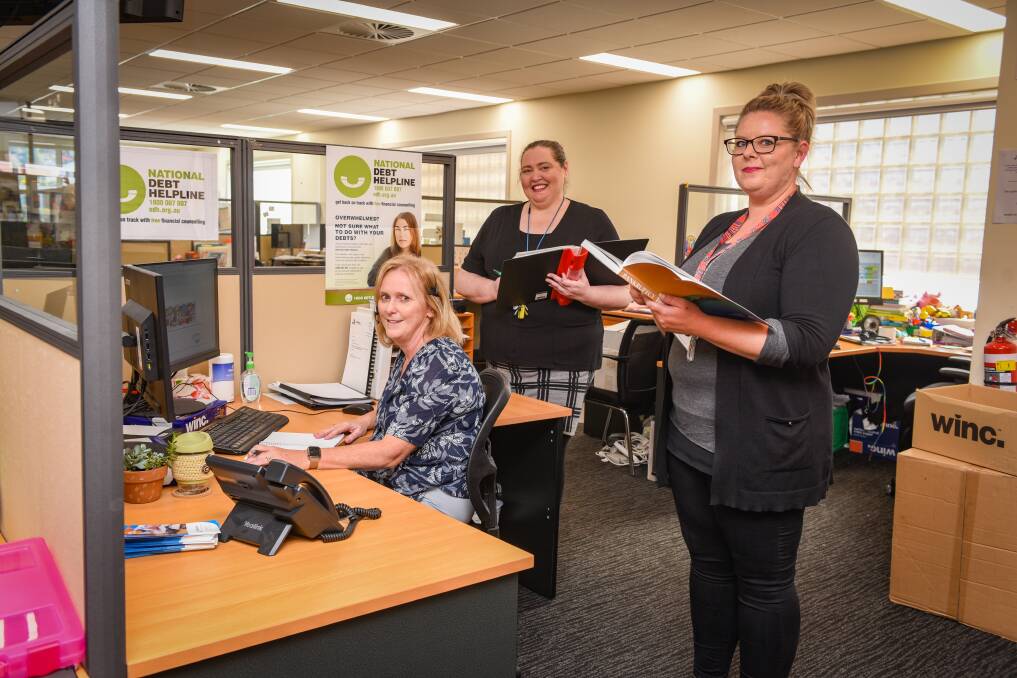 TAKING CALLS: Marguerite Smith, Danielle Slade, Kelly Jennings work as financial counsellors for Anglicare Tasmania at Launceston. The service is encouraging people in need to reach out for assistance by calling 1800 007 007. Picture: Paul Scambler.