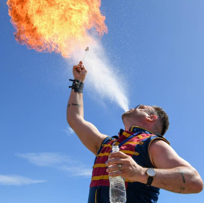 STUNNING SIGHT: World famous fire breather and stilt walker Roy Maloy proved popular with Exeter Show attendees on Saturday. Picture: Neil Richardson 