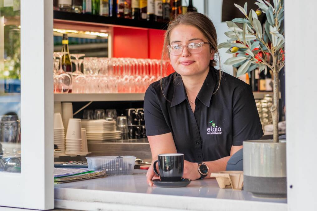 CASUAL CONCERNS: Cafe worker Emma Cameron is worried about the financial impact potential coronavirus-related closures of businesses could have. Picture: Phillip Biggs 