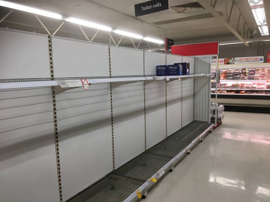 STRANGE SIGHT: Shelves normally stocked full of toilet paper at Coles in Launceston on Monday. Picture: Ryan Young